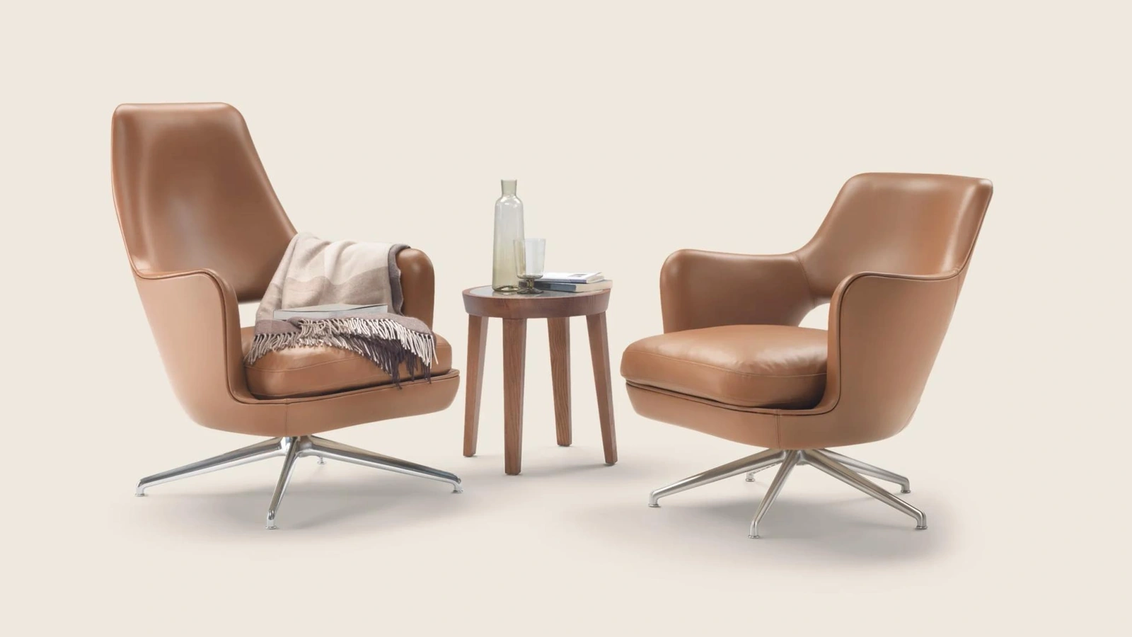 Poltrona Eliseo in pelle con base girevole in alluminio di Flexform