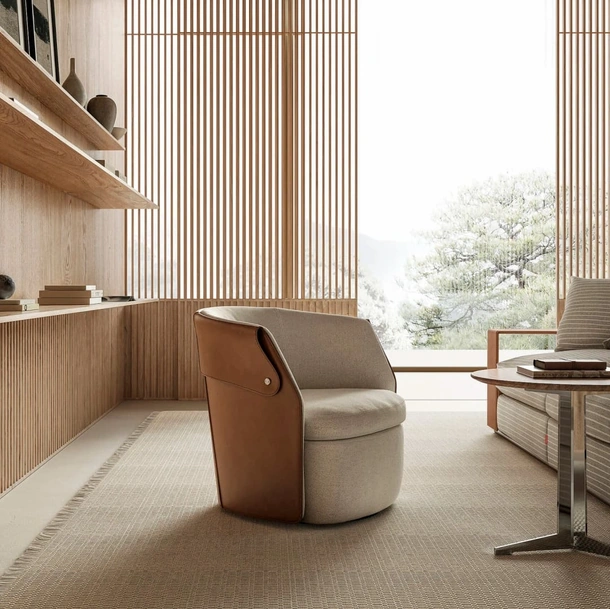 Poltroncina Ozzy in tessuto imbottito e cuoio di Flexform
