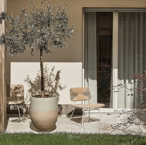 Poltroncina Echoes Outdoor in cordoncino di polipropilene e acciaio di Flexform